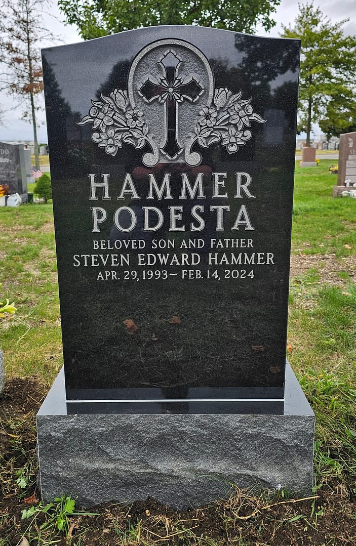 Upright Jet Black Granite Monument with Cross and Flowers