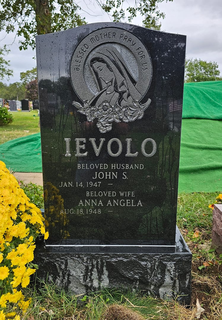 Upright Jet Black Mist Granite Monument with the Blessed Mother